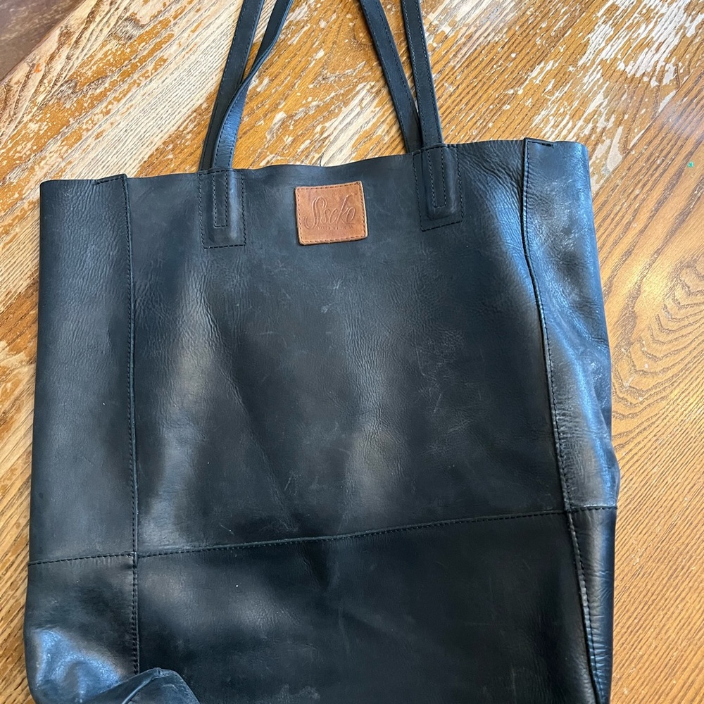 Gently used Sseko bucket bag in genuine black leather.